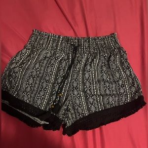 Black and white woman’s short boho style shorts.